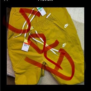 Nike standard fit taper leg pants Mustard/White sizes L and XL 50.00 each